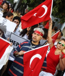Demonstrators hold flags during a protest against recent terrorist attacks on September 7, 2015 in Kizilay Square in Ankara. The Turkish army on September 7 said the outlawed Kurdistan Workers Party (PKK) killed 16 of its soldiers in a roadside bomb attack at the weekend, one of the deadliest attacks carried out by the group. Prime Minister Ahmet Davutoglu vowed after September 6 attack to "wipe out" the PKK rebels from their mountain strongholds, with no end in sight to the Turkish military's one-and-half month campaign against the Kurdish rebels. AFP PHOTO/ADEM ALTAN TURKEY-TERRORISM-PROTEST
