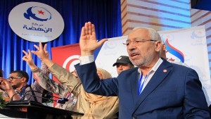 TUNISIA, TUNIS - MAY 23: President of Ennahda movement Rached Ghannouchi (2nd R) greet supporters at the Olympic Hall in Rades after the congress of Tunisian Ennahda Party in Tunisia, Tunis on May 23, 2016. (Photo by Yassine Gaidi/Anadolu Agency/Getty Images)